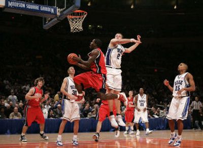 
Jeremy Pargo, who led Gonzaga with 21 points, drives to the basket Thursday night against Duke's Josh McRoberts during the Zags' loss at Madison Square Garden. 
 (Associated Press / The Spokesman-Review)