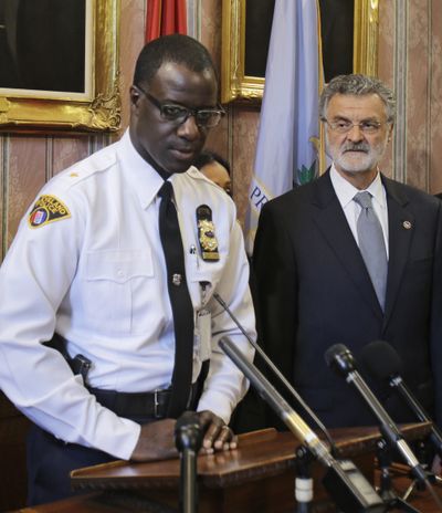 Cleveland police Chief Calvin Williams, left, speaks at a news conference Tuesday in Cleveland. Mayor Frank Jackson listens. (Associated Press)