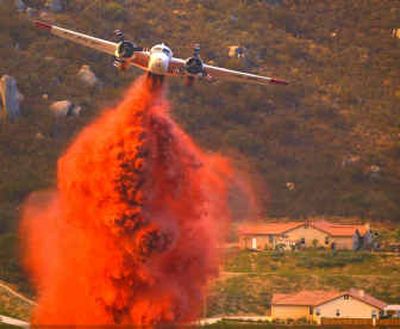 
A California Department of Forestry aerial tanker drops a load of retardant near Ramona, Calif., during a wildfire in May 2003. Safety concerns had prompted the grounding of 33 planes.
 (File/Associated Press / The Spokesman-Review)
