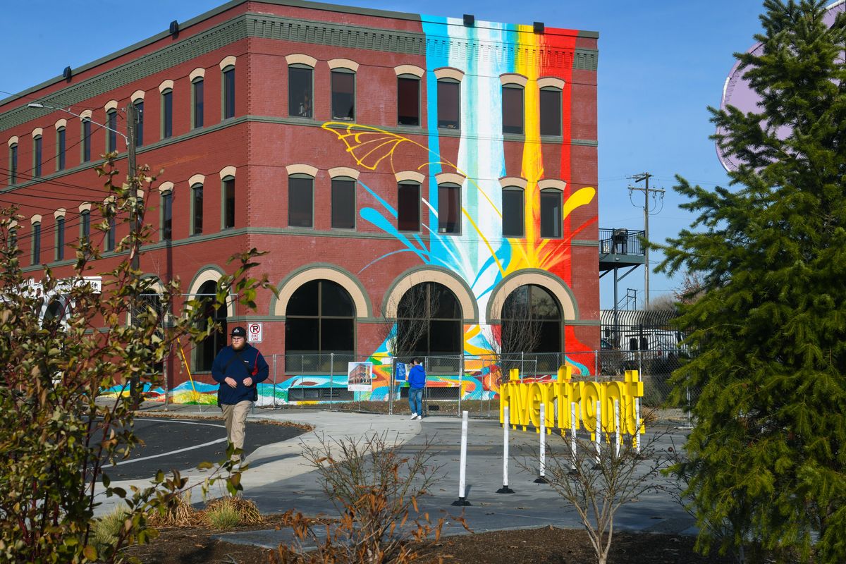 A proposed development on the northbank of the Spokane River near the Spokane Arena may bring another high rise. Right now, the historical building there has a mural. It