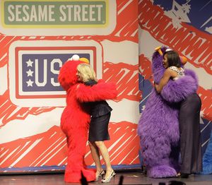 First lady Michelle Obama, right, and Jill Biden, wife of Vice President Joe Biden, are greeted by Sesame Street characters during a USO and Sesame Street event honoring National Guard members and their families Thursday, April 14, 2011, in Columbus, Ohio. Today's event highlighted how several businesses have made commitments to ensure transferability to military members and their spouses. (Jay Laprete / Fr52593 Ap)