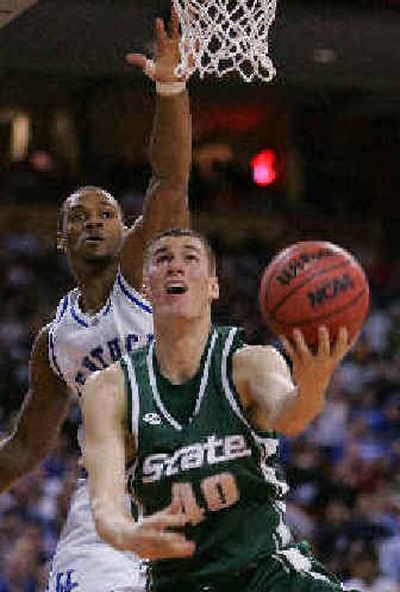 
Michigan State's Paul Davis shoots under the defense of Kentucky's Rajon Rondo. 
 (Associated Press / The Spokesman-Review)