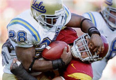 
USC's Kaluka Maiava, right, brings down UCLA's Chris Markey. Associated Press
 (Associated Press / The Spokesman-Review)