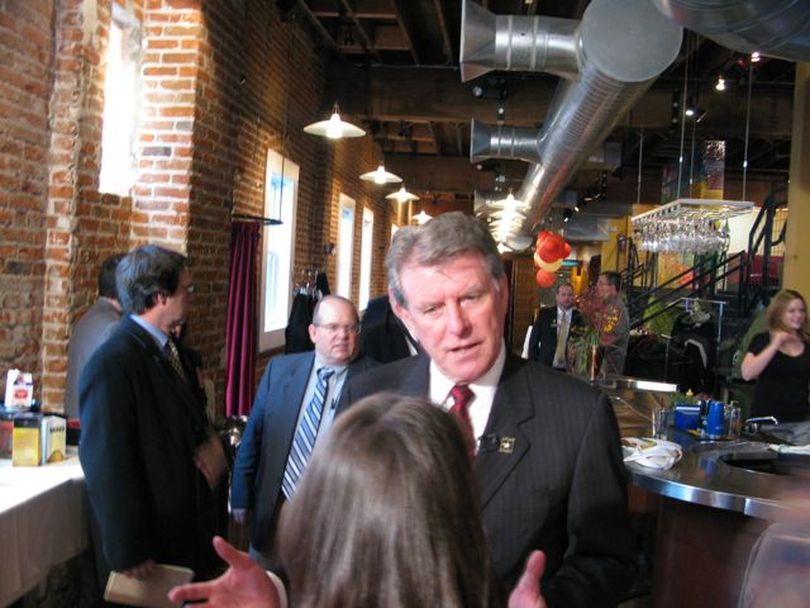 Gov. Butch Otter visits with members of the press after his annual talk to the Idaho Press Club on Wednesday. Otter said during his talk that he supports a 1 percent COLA for state retirees; he's still waiting to announce his re-election plans; and he opposes pending legislation to gut last year's bill to require vehicle emission testing in Canyon County. (Betsy Russell)
