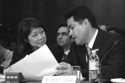
Former U.S. attorneys Carol Lam and David Iglesias prepare to testify March 6  before the Senate Judiciary Committee hearing. 
 (Associated Press / The Spokesman-Review)
