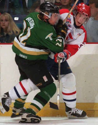 
Chiefs #22 Cam Severson fires the puck away while getting heavey pressure from Val-d'Or #22 Steve Begin in the 1st period Saturday night.  Severson later scored in the the 2nd period.  Dan  Pelle photo 
 (SR / The Spokesman-Review)