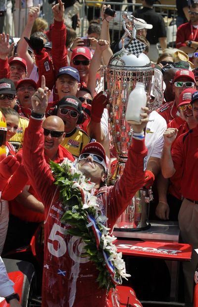 Dario Franchitti, of Scotland, celebrates in victory circle after winning IndyCar's Indianapolis 500 auto race at Indianapolis Motor Speedway in Indianapolis, Sunday, May 27, 2012. (Michael Conroy / Associated Press)