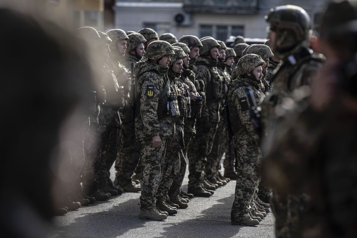 Ukrainian soldiers in the main square during an unannounced visit by President Volodymyr Zelenskyy of Ukraine in the newly liberated city of Kherson, Ukraine, Nov. 14, 2022. The president
