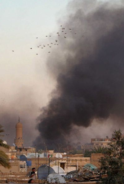 
A huge cloud of smoke billows into the sky after a car bomb explosion in the Shiite district of Sadr City in Baghdad, Iraq, on Sunday. 
 (Associated Press / The Spokesman-Review)