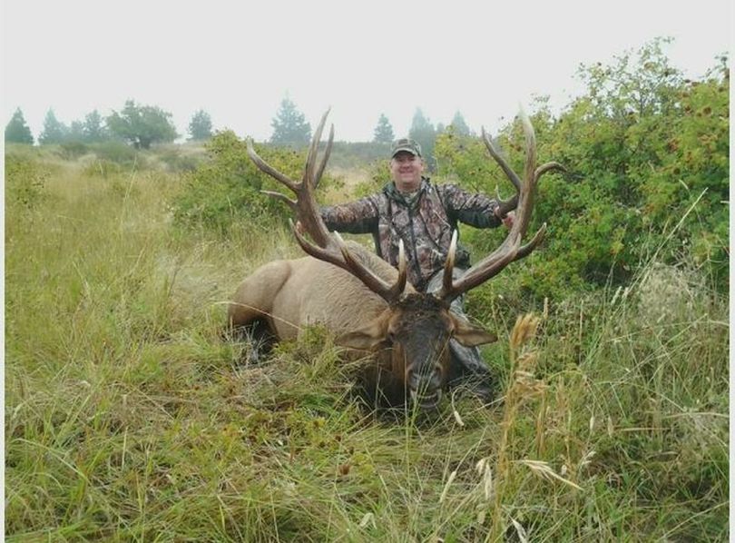 Jim Eggart of Walla Walla poses next to 8-by-8 point bull elk he shot on Sept. 26 in the Blue Creek Unit east of Wall a Walla. He had the only rifle bull elk hunting permit for the area and shot the elk on a farm signed up in Washington's Feel Free to Hunt Program. (Mike Mahan)