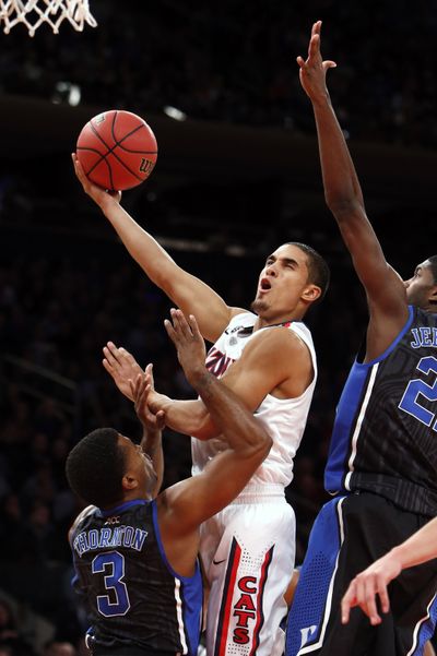 Arizona’s Nick Johnson scored 13 points in the second half as the Wildcats handed the Blue Devils their second loss of the season. (Associated Press)