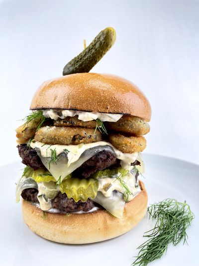 Triple Pickle Smash Burger is the grand prize winner of the 2021 Art of the Burger competition sponsored by Heinz Corp. Jessica Hayne of Spokane created the burger recipe and will receive $25,000 and other gifts.  (Courtesy)