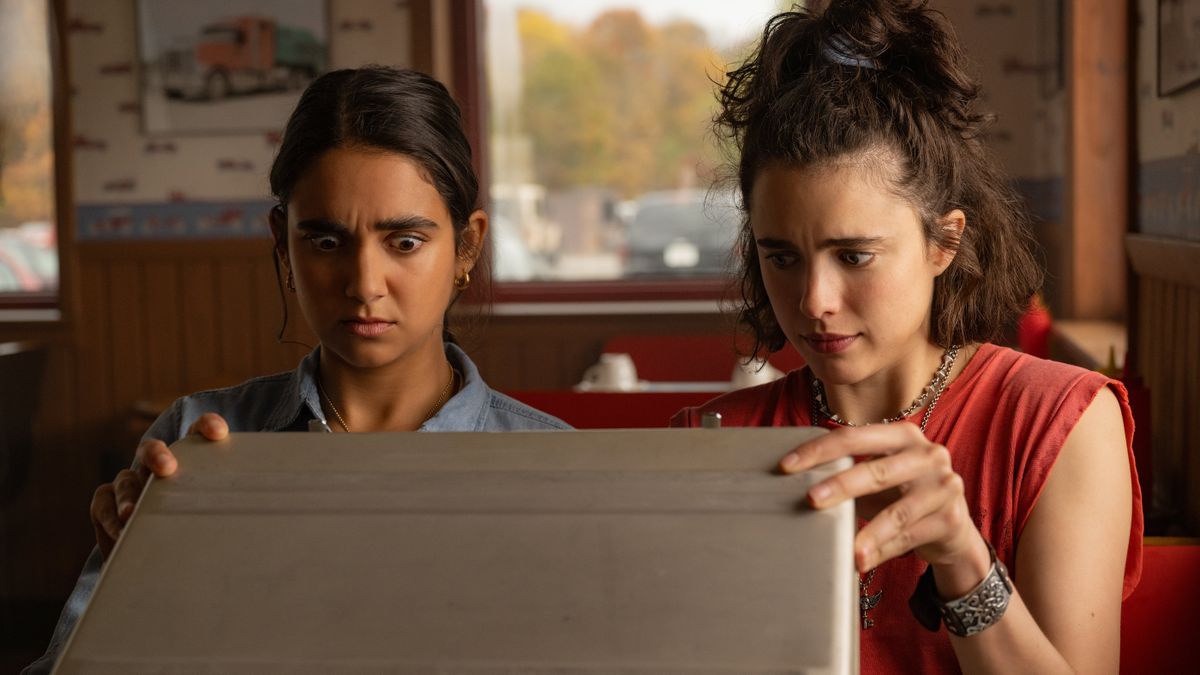 Geraldine Viswanathan, left, as Marian and Margaret Qualley as Jamie in director Ethan Coen’s “Drive-Away Dolls.”  (Focus Features)
