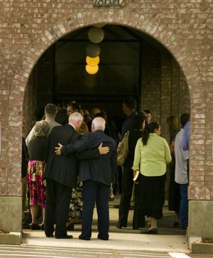 Mourners gather outside the Greenacres Baptist Church Monday after the memorial for Pastor Wayne Scott  Creach, 74, who was shot and killed last Wednesday night by Spokane Valley police officer Brian Hirzel. (Colin Mulvany / The Spokesman-Review)