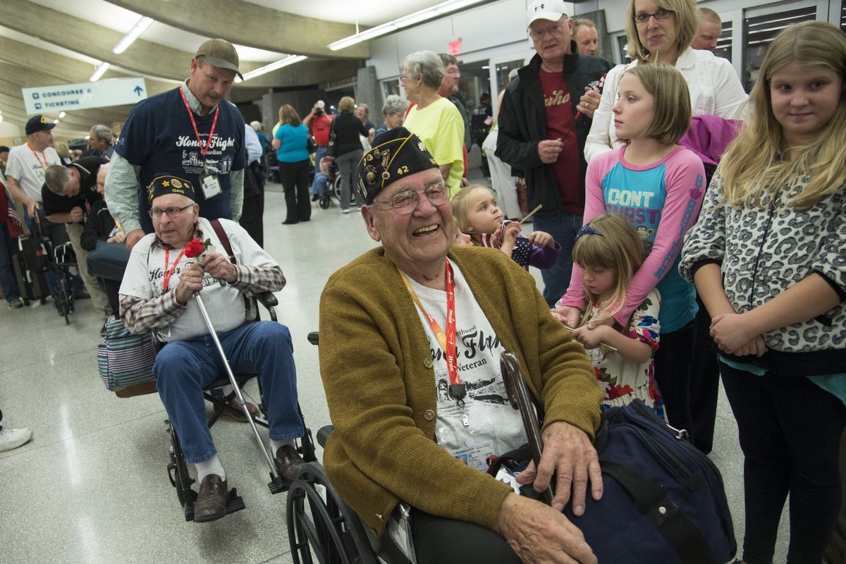 World War II veteran Bub Budig and more than 80 other Inland Northwest military veterans receive a heroes’ welcome from hundreds of well-wishers, friends and family after returning to Spokane International Airport from an Honor Flight to Washington, D.C., on Sept. 25. (Colin Mulvany)