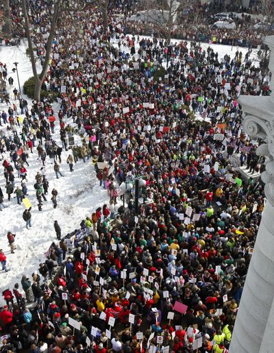 Protesters demonstrate against Wisconsin Gov. Scott Walker’s proposal to eliminate state workers union rights Wednesday at the Capitol in Madison. (Associated Press)