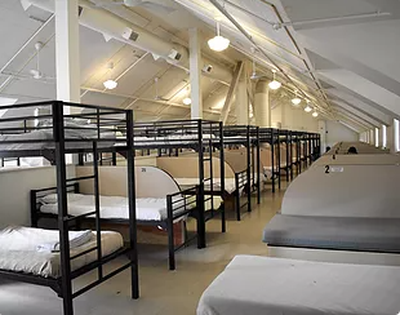 Beds at the House of Charity are shown in this 2021 photo. A downtown business owner has filed a tort claim alleging that properties owned by Catholic Charities of Eastern Washington have attracted criminal activity.  (Courtesy of House of Charity)