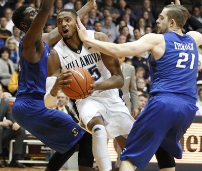 Villanova's Mikal Bridges drives past two Creighton defenders during the Wildcats’ 79-63 win on Saturday. (Charles Fox / AP)