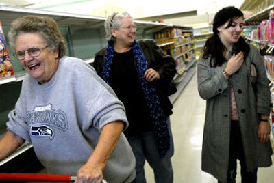 
Three generations of Lockridge women, from left, Joan, Ann and Lynn, share a laugh as they tell stories at the Safeway at Third and Maple in Spokane. 
 (Photosby Jed Conklin / The Spokesman-Review)