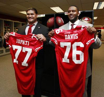 Anthony Davis, right, was a San Francisco 49ers first-round draft pick, along with Mike Iupati, left, from Idaho, in 2010. (Paul Sakuma / Associated Press)