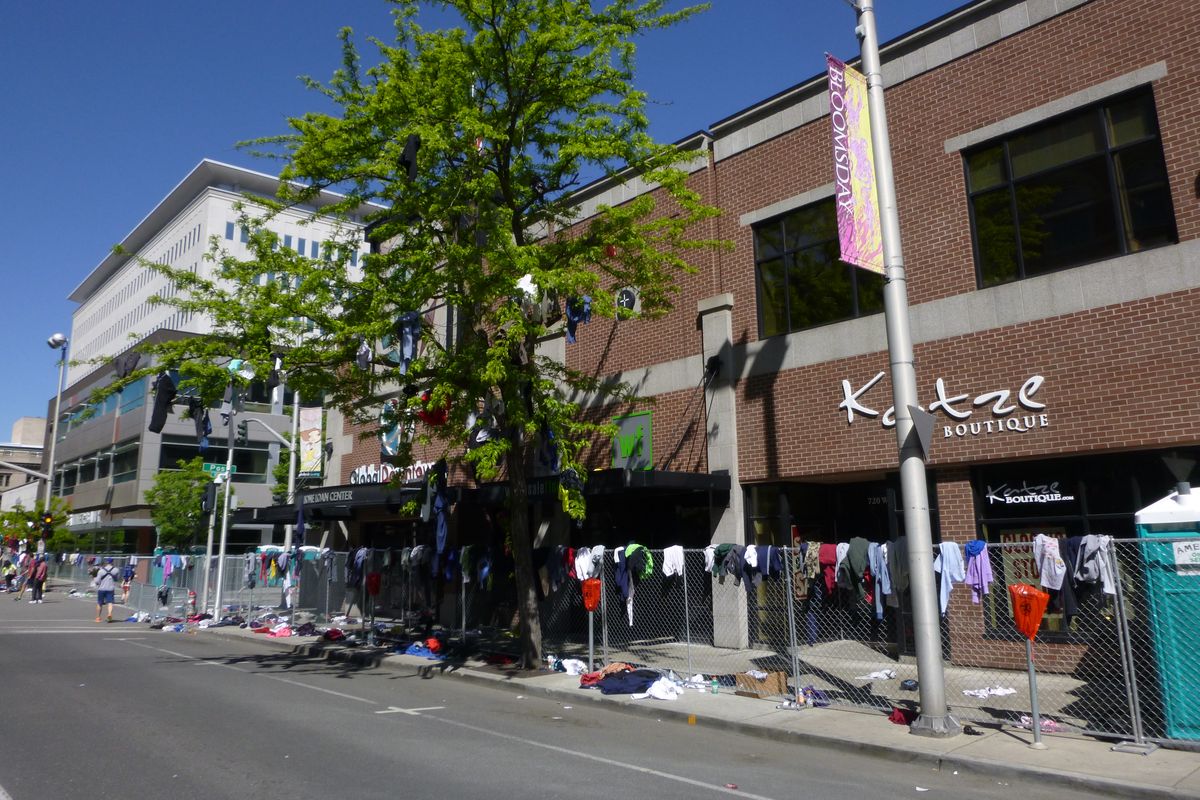 Aftermath at the start of Bloomsday 2016. Extra clothing yard sale anyone? (Rich Landers)