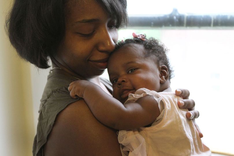 Voletta Bonner, 29, of Highland Park, Mich., poses for a portrait with her 2-month-old baby Riley Johnson. Voletta had decided that breast-feeding was something she was going to do before the birth of her child. She was very happy with the support she received from the staff at St. John Hospital in Detroit. (McClatchy-Tribune)