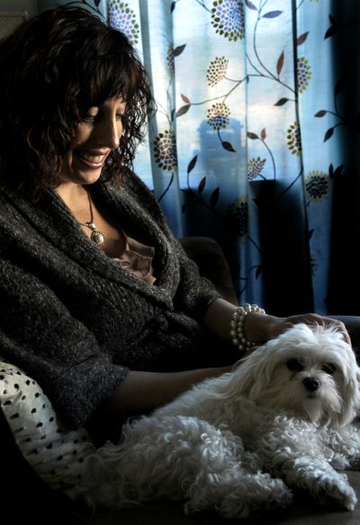 Eve Angela Foster,  executive director of Abundant Wellness Center, with her dog Chloe at her office in Post Falls on , Nov. 10. Foster and Lynette Gneiting plan to start Peace of Mind Yoga Therapy to help at-risk community members.kathypl@spokesman.com (Kathy Plonka)