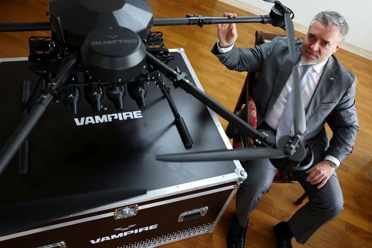 Ukraine’s Ambassador to Japan Yurii Lutovinov poses for a photograph next to a mockup of Ukrainian-made Vampire drone during an interview with Reuters at Ukraine Embassy on April 28, in Tokyo.  (Reuters )