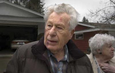 
Ed and Beth Tietjen stand in their driveway talking with neighbors Monday, showing the bruises from the attack in their garage as they were returning home Sunday. 