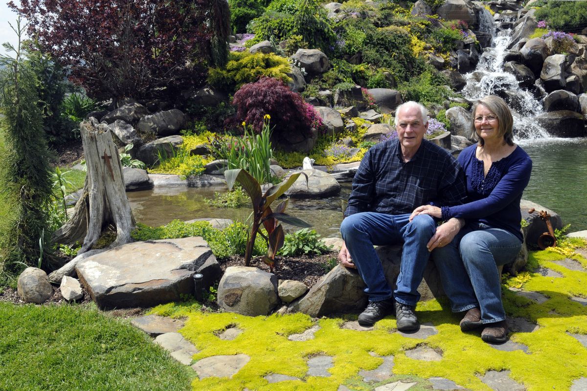 Stan and Donna Canter’s backyard includes pillow basalt rocks with a cascading water feature, surrounded by colorful garden plants intertwined among the rock crevasses. (J. Bart Rayniak)