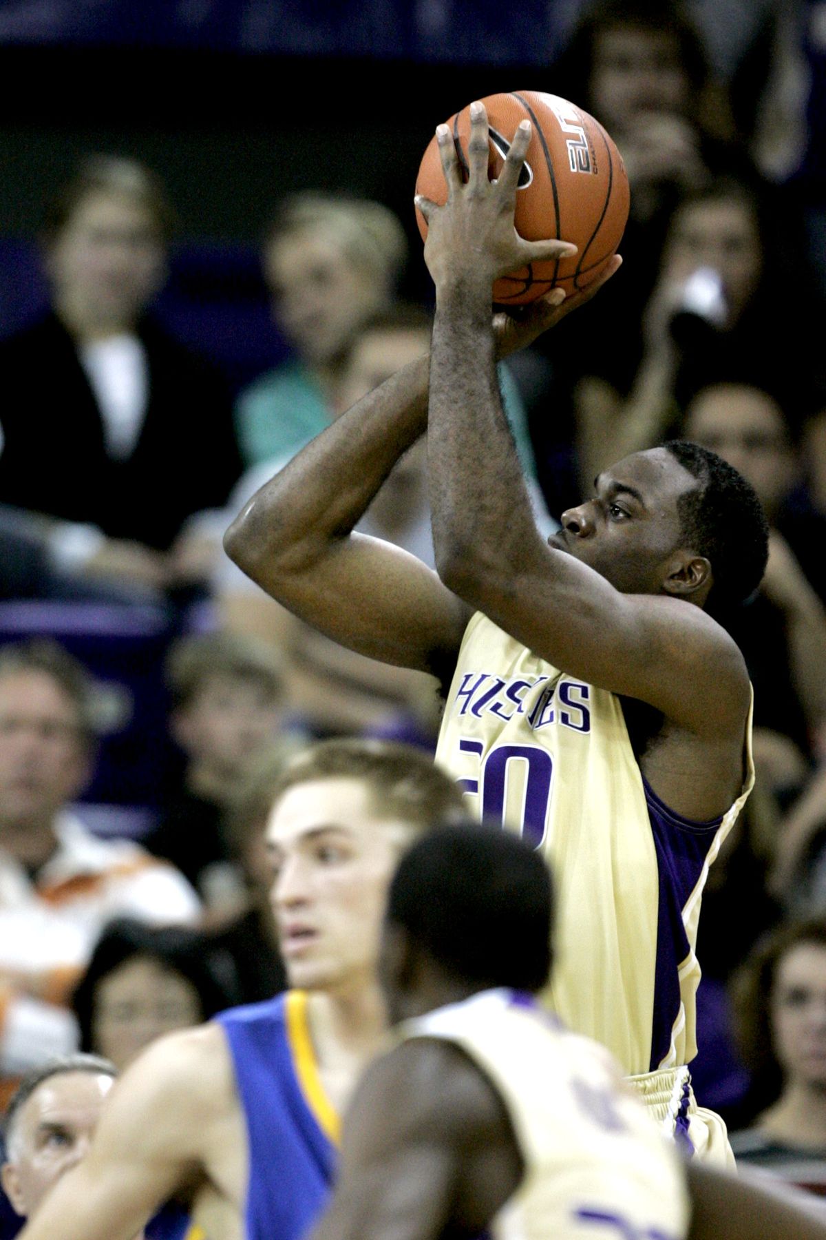 Quincy Pondexter scores two of his team-high 30 points for the Huskies.  (Associated Press)