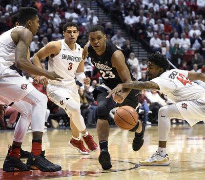 Gonzaga’s Zach Norvell Jr. dribbles into traffic against a trio of San Diego State players. (Denis Poroy / Associated Press)