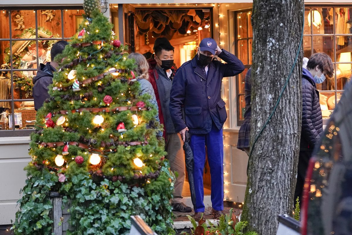 President Joe Biden walks out of a shop as he visits Nantucket, Mass., with family Friday, Nov. 26, 2021.  (Carolyn Kaster)