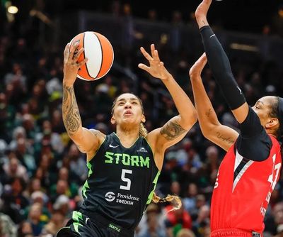 Seattle guard Gabby Williams tries to clear space under the basket for a shot against Las Vegas’ A’ja Wilson last season. (Dean Rutz/Seattle Times)