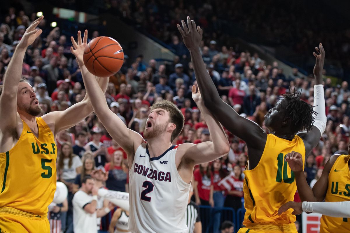 Gonzaga forward Drew Timme (2) competes for rebound with San Francisco center Jimbo Lull (5) and  forward Josh Kunen (10)Thurs., Feb. 20, 2020, during a college basketball game in the McCarthey Athletic Center. (Colin Mulvany / The Spokesman-Review)