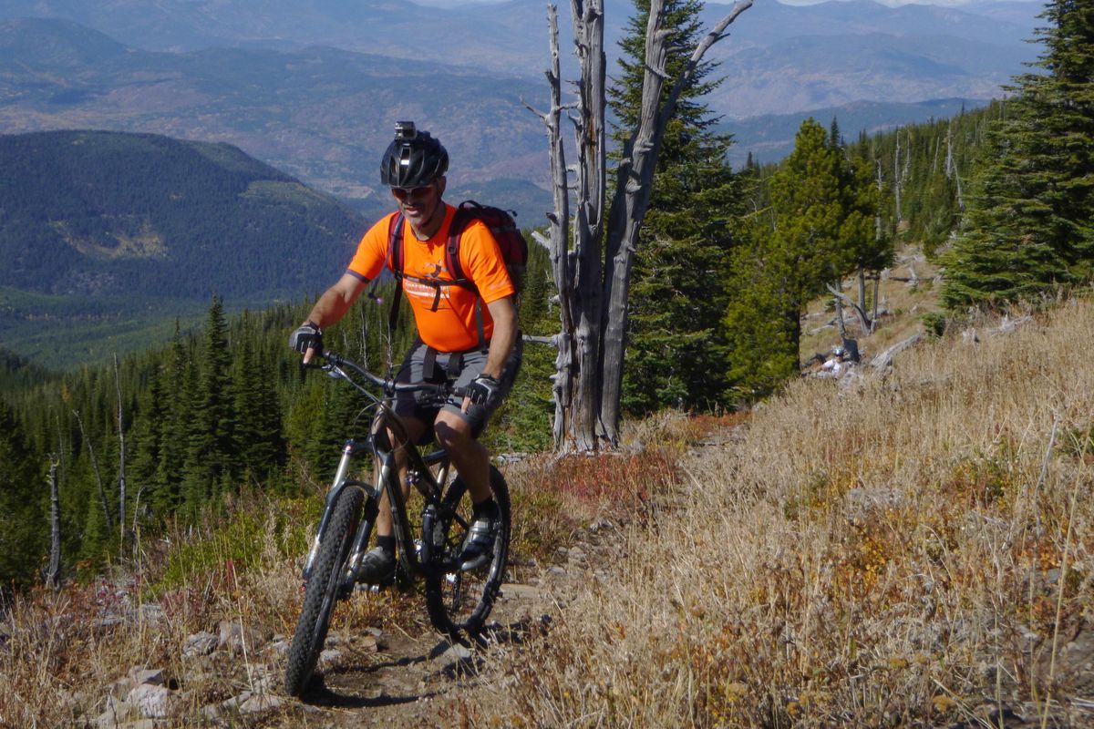 Erik Schmidt, Gonzaga University associate professor of philosophy, ponders the meaning of gravity as he pedals his mountain bike in the first weekend of October above treeline on Abercrombie Mountain northwest of Metaline Falls. (Rich Landers / The Spokesman-Review)