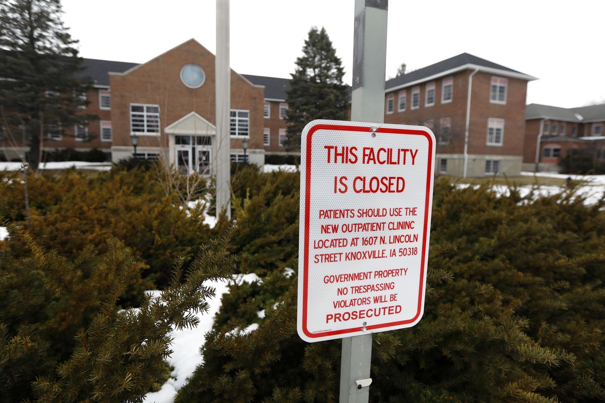 A facility closed sign hangs in front of the main building on the Veterans Affairs campus, Tuesday, March 12, 2019, in Knoxville, Iowa. Since the Veterans Affairs moved out of the sprawling campus on the edge of Knoxville a decade ago, local leaders have become increasingly anxious about the ghost town on the edge of their living community. (Charlie Neibergall / AP)