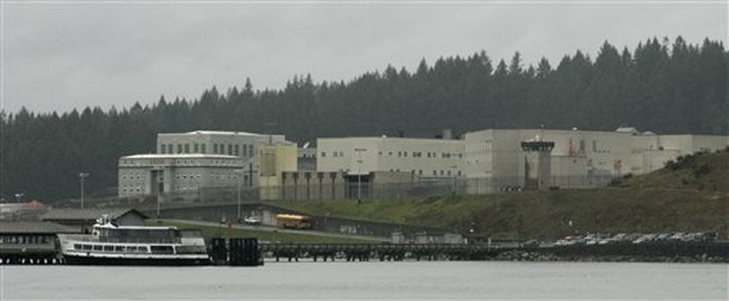 In this Feb. 14, 2007 file photo taken from a boat, the McNeil Island Correctional Center in Washington state is shown. Washington state said Friday, Nov. 19, 2010, that it will close the McNeil Island Corrections Center in April, 2011, to save money. McNeil Island is also home to the state's Special Commitment Center, where sexually violent predators are indefinitely held for treatment after completing their prison sentences, but that facility will remain open. (Ted Warren /  (AP Photo/Ted S. Warren, File))