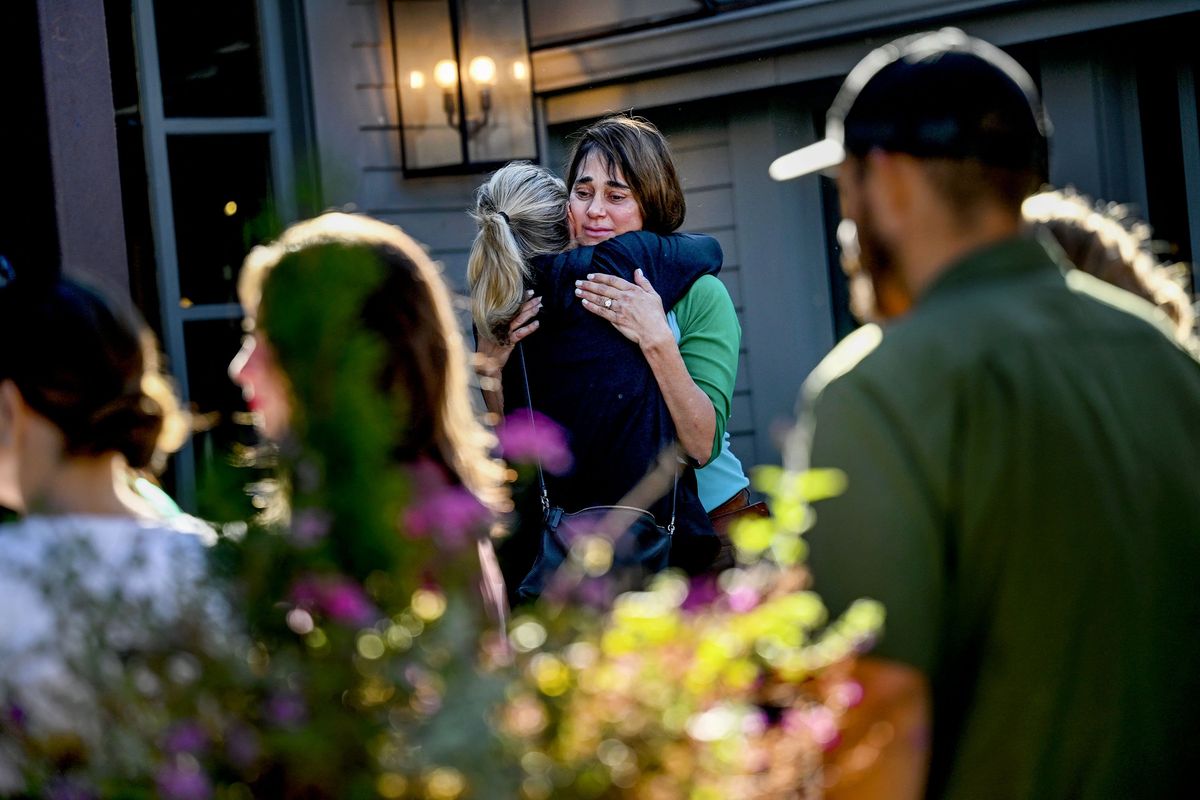 A crowd gathers as restaurant owner Celeste Shaw gets a hug while saying goodbye to her loyal customers at Chaps on Saturday.  (Kathy Plonka/The Spokesman-Revie)