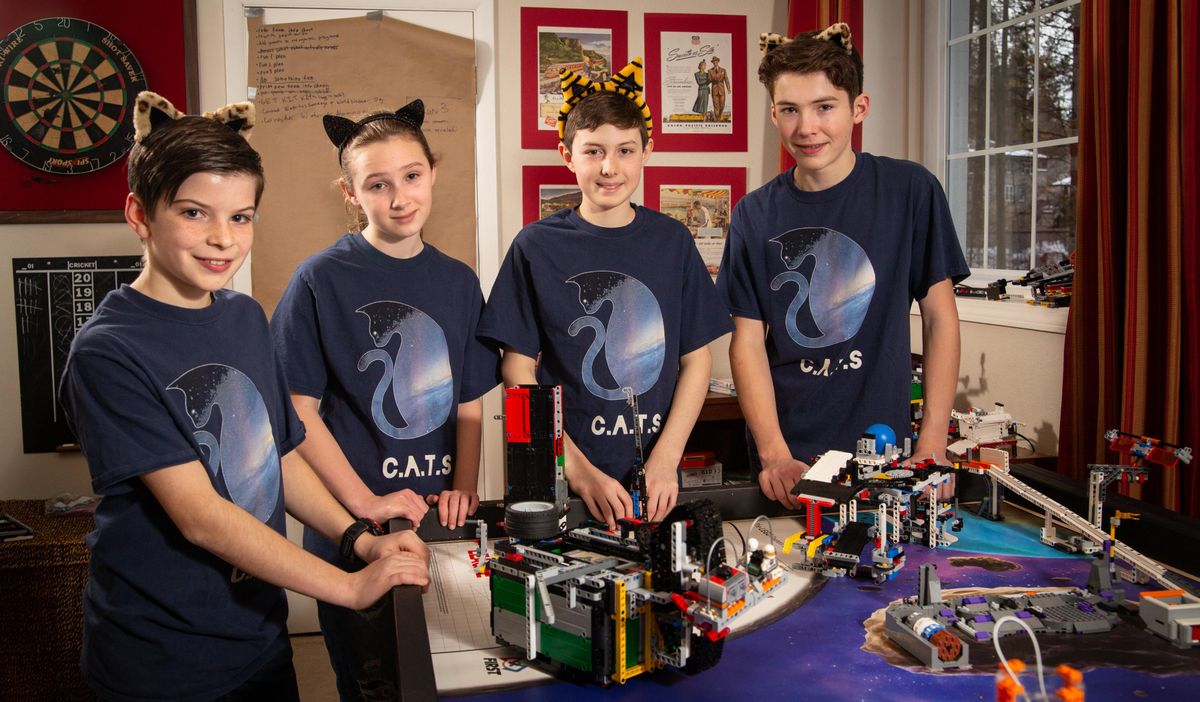 From left, 12-year-old Cole Bonawitz, 13-year-old Alice Rudders, 14-year-old Sasha Sharman and 12-year-old Thomas Glavin of the C.A.T.S. Lego team pose for a photo on Jan. 28, 2019, at the home of their coach, Lisa Glavin, in Spokane, Wash. The team, which is comprised of members from four different Spokane schools, advanced from state to the international competition that will take place at Legoland in Anaheim, California, in May 2019. (Libby Kamrowski / The Spokesman-Review)