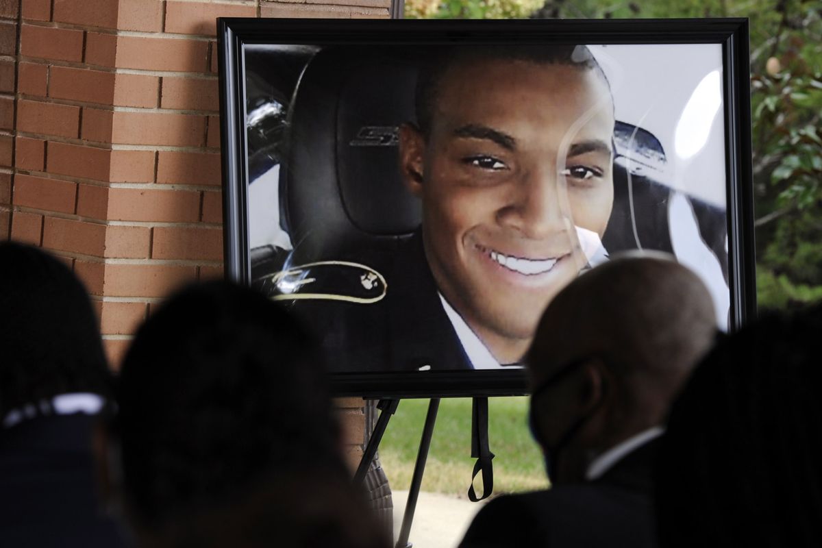 HFM*A photograph of Army veteran Damian Daniels is displayed before mourners during his funeral at Alabama National Cemetery in Montevallo, Ala., on Friday, Sept. 11, 2020. Daniels, an Alabama native who served in Afghanistan, was fatally shot by a sheriff