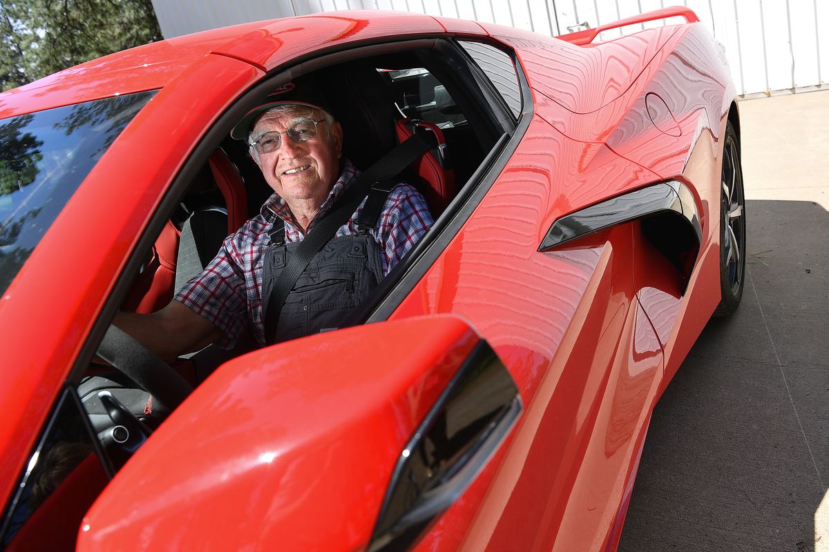 Vern Eden, 87, sits for a photograph with his brand new 2021 C8 Corvette on Thursday at his home in Valleyford. For various reasons, Eden had to wait 18 months until his dream ride was available for picking up.  (Tyler Tjomsland/The Spokesman-Review)