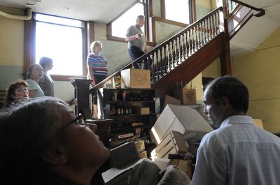 Dave Ross leads a tour up the stairs at the historic 1902 McKinley Elementary School at Riverside Avenue and Napa Street July 16.   (Dan Pelle / The Spokesman-Review)