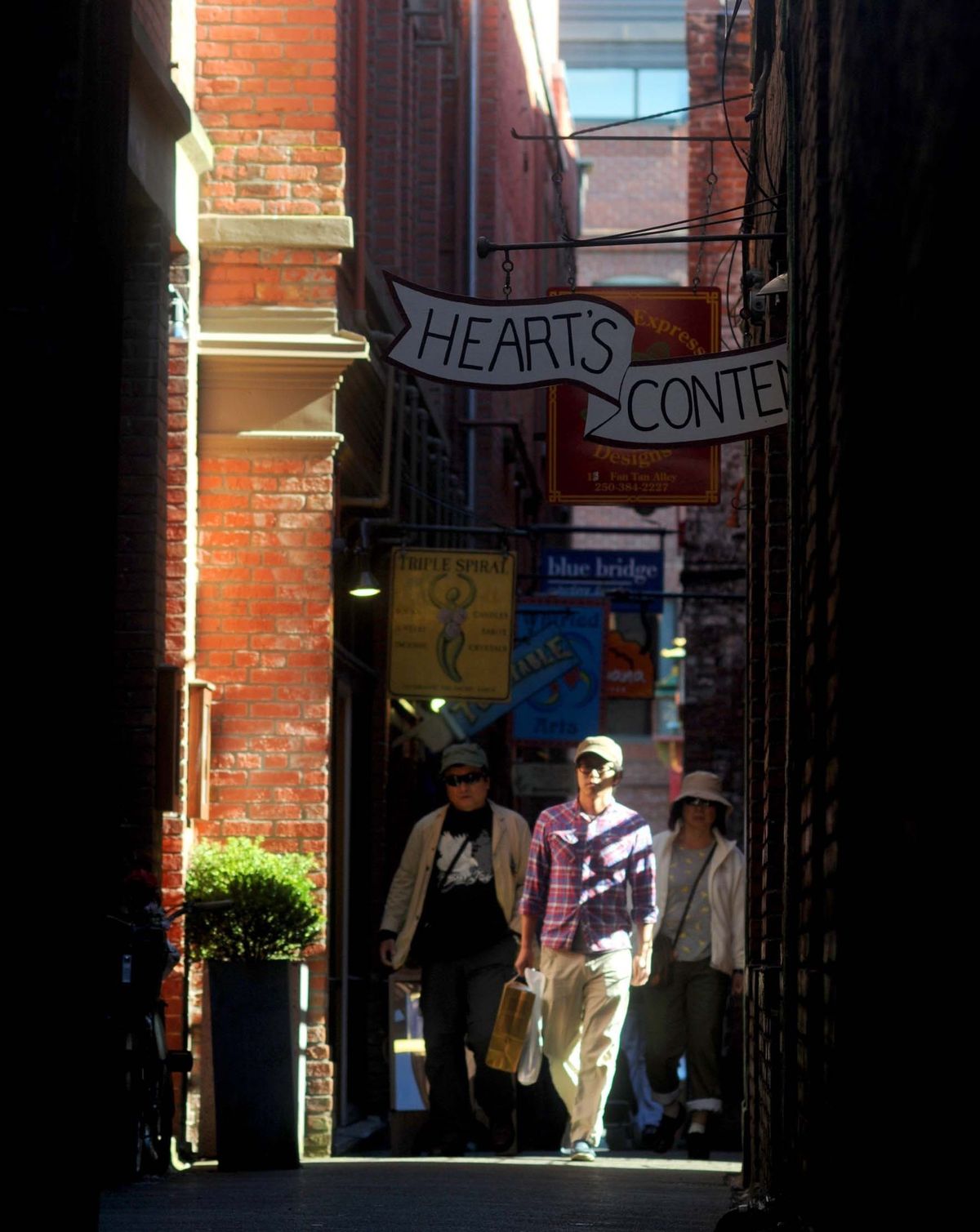 Shoppers walk through Chinatown’s Fan Tan Alley.