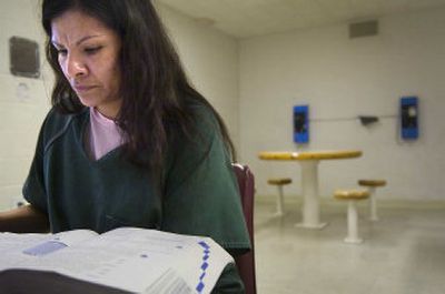 
Maria Fuentes, an inmate at the Spokane County Jail, studies for the math section of the GED exam on Friday morning. 
 (Holly Pickett / The Spokesman-Review)