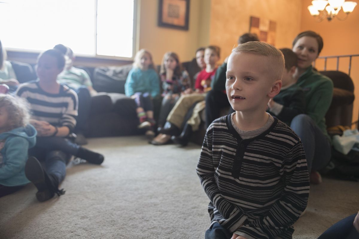 Grayson Mortlock, 6, leans forward and watches the first episode of “Sesame Street” that features Julia, an autistic character, Monday, April 10, 2017, at his North Spokane home. Families affected by autism gathered to watch the program. (Jesse Tinsley / The Spokesman-Review)
