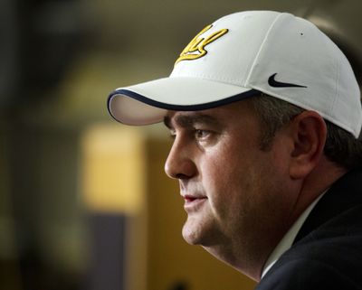 New head coach Sonny Dykes shows off his Cal headgear at news conference on Thursday. (Associated Press)