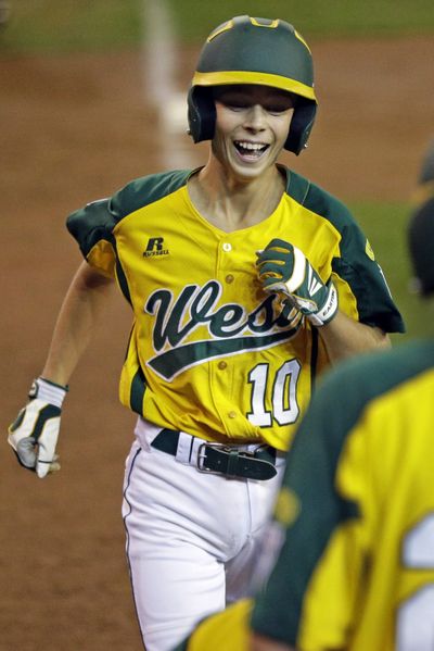 Hance Smith is all smiles after slugging a three-run homer for Petaluma, Calif., in the Little League World Series. (Associated Press)