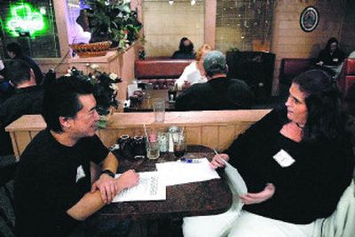 
Brian Ang is interviewed by Toni Seidel at the Spokane Christian Singles Speed Dating at Cafe Donna in Spokane Valley.
 (Photos by DAN PELLE / The Spokesman-Review)