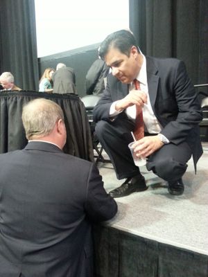 Idaho Congressman Raul Labrador, chairman of the state GOP convention, confers after the convention broke up in disarray on Saturday (Idaho Public TV / Melissa Davlin)